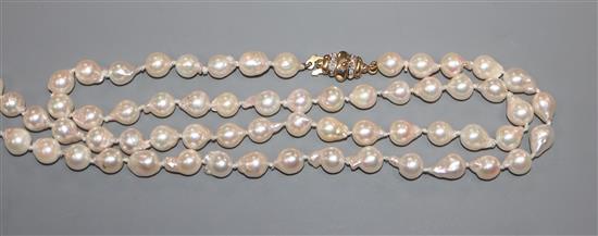 A modern single strand cultured baroque pearl necklace, with 9ct gold and diamond chip set clasp, 65cm